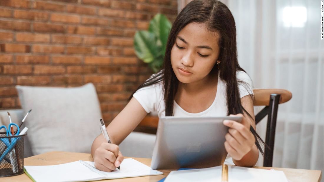 Young teen girl studying